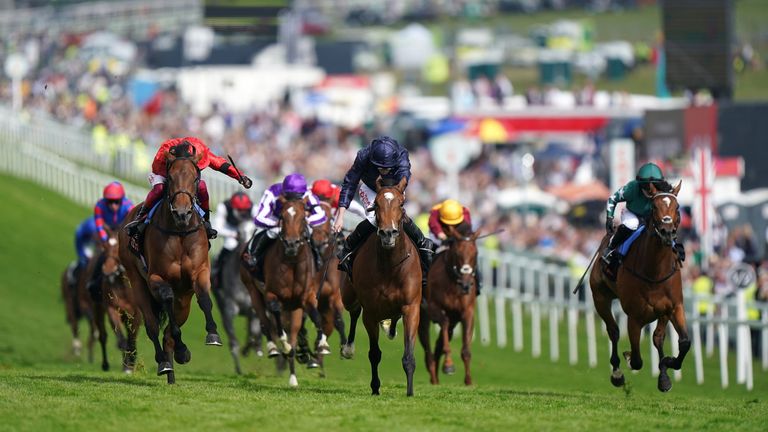 Nashwa (green) chases home Oaks front two Tuesday and Emily Upjohn at Epsom