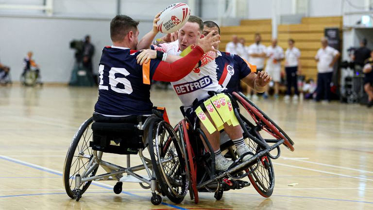 England's Nathan Collins is tackled by France's Damien Dore