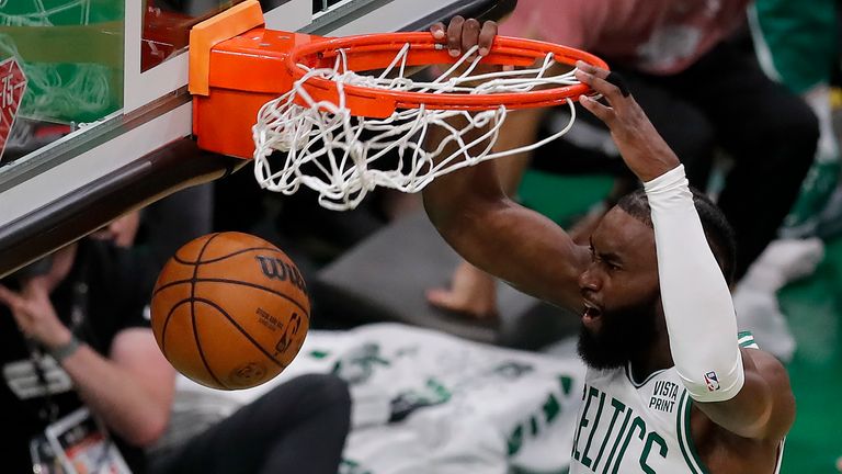Boston Celtics guard Jaylen Brown (7) dunks the ball against the Golden State Warriors during the second quarter of Game 3 of basketball&#39;s NBA Finals, Wednesday, June 8