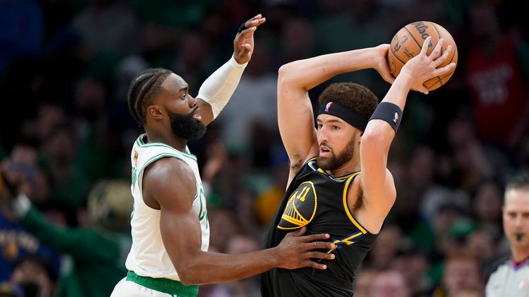 Golden State Warriors guard Klay Thompson (11) looks to pass against Boston Celtics guard Jaylen Brown (7) during the first quarter of Game 3 of basketball&#39;s NBA Finals, Wednesday, June 8