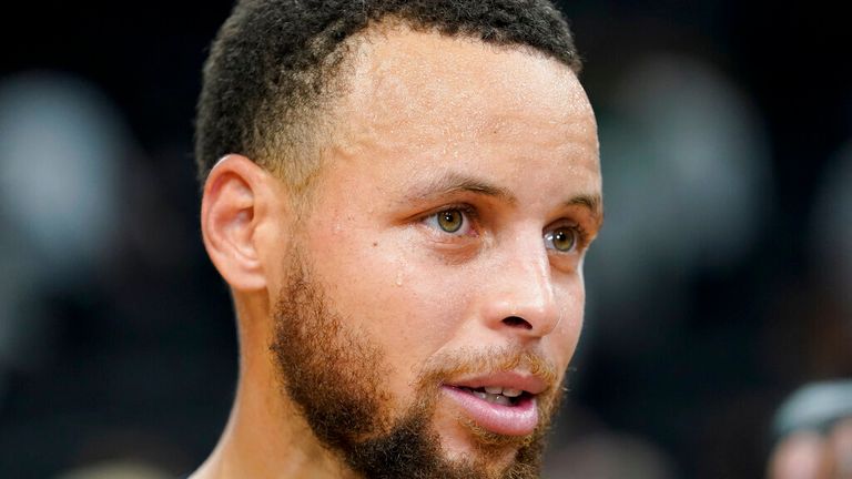 Golden State Warriors guard Stephen Curry (30) walks off the court after beating the Boston Celtics in Game 4 of basketball's NBA Finals, Friday, June 10, 2022, in Boston. (AP Photo/Steven Senne)


