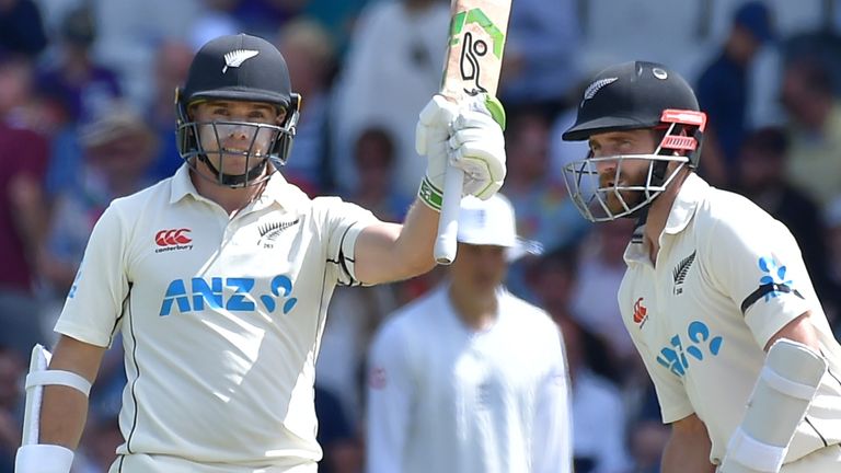 New Zealand's Tom Latham, left, celebrates after scoring half century alongside New Zealand's Kane Williamson during the third day of the third cricket test match between England and New Zealand at Headingley in Leeds, England, Saturday, June 25, 2022. (AP Photo/Rui Vieira)