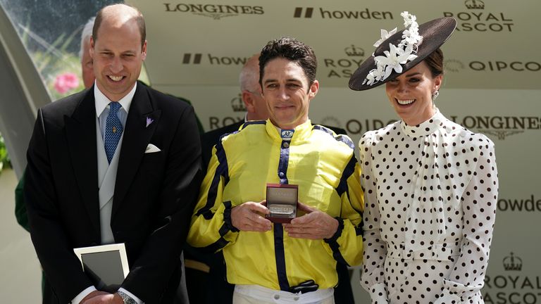 Christophe Soumillon receives his prize for the winning ride on Commonwealth Cup star Perfect Power