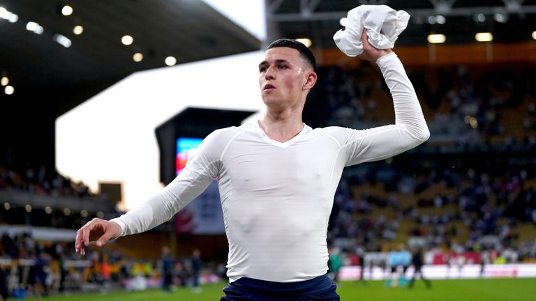 Phil Foden throws his shirt into the crowd after the defeat to Hungary