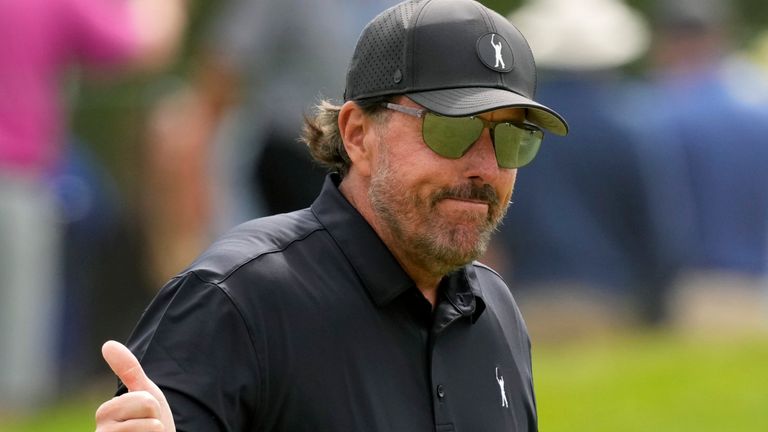 Phil Mickelson reacts to the crowd on the eighth hole during the first round of the U.S. Open golf tournament at The Country Club, Thursday, June 16, 2022, in Brookline, Mass. (AP Photo/Charlie Riedel)