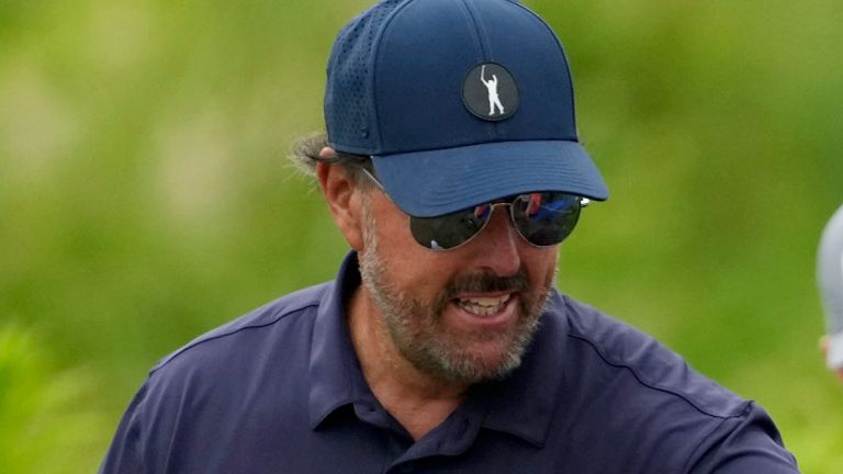 Phil Mickelson greets fans during the second round of the U.S. Open golf tournament at The Country Club, Friday, June 17, 2022, in Brookline, Mass. (AP Photo/Robert F. Bukaty) 