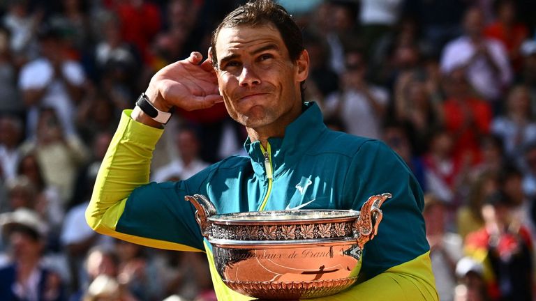 Spain&#39;s Rafael Nadal celebrates with the trophy after winning against Norway&#39;s Casper Ruud at the end of their men&#39;s singles final match on day fifteen of the Roland-Garros Open tennis tournament at the Court Philippe-Chatrier in Paris on June 5, 2022. (Photo by Anne-Christine POUJOULAT / AFP) (Photo by ANNE-CHRISTINE POUJOULAT/AFP via Getty Images)