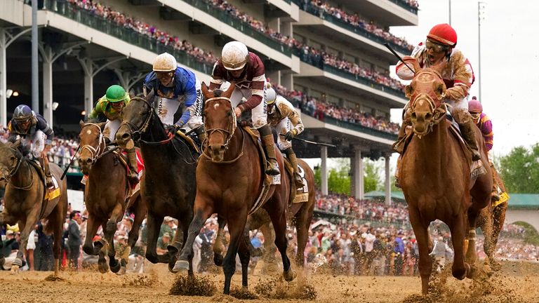 Rich Strike, front right, with Sonny Leon on board, wins the 148th heat of the Kentucky Derby