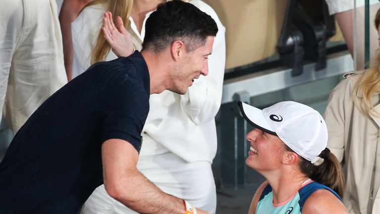 Polish heroes Robert Lewandowski (left) and Iga Swiatek greet each other after her French Open victory in Paris