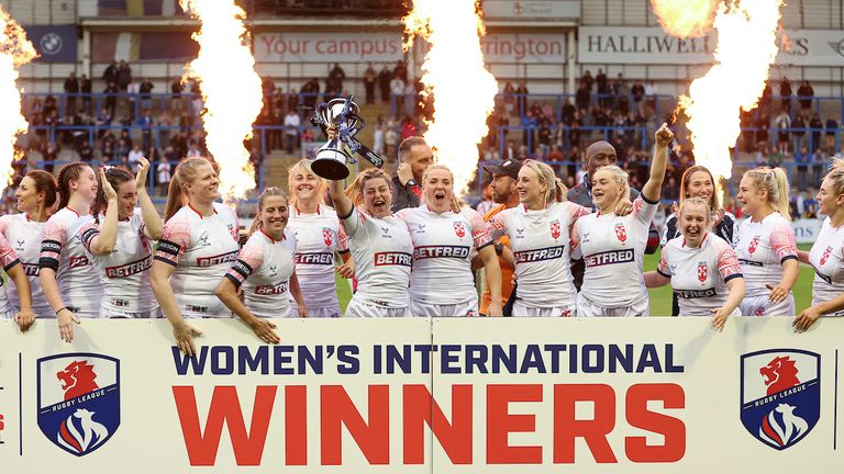 Picture by Paul Currie/SWpix.com - 18/06/2022 - Rugby League - Women...s International Match - England v France - Halliwell Jones Stadium, Warrington, England - Emily Rudge of England lifts the trophy 