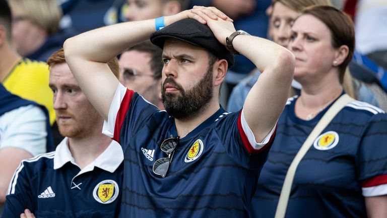A Scotland fan looks depressed after the defeat in Dublin