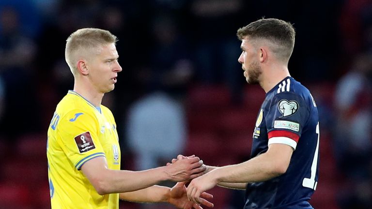 Ukraine&#39;s Oleksandr Zinchenko shakes hands with Scotland&#39;s Ryan Christie