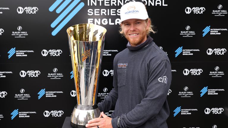 Scott Vincent poses with the International Series England trophy following victory