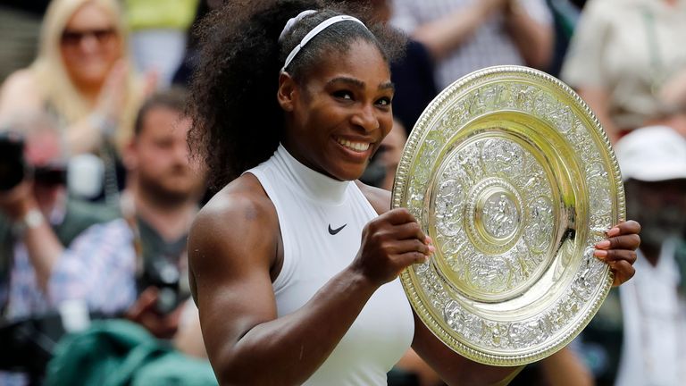 Serena Williams of the USA holds her trophy after winning the women's singles final against Angelique Kerber of Germany on day thirteen of the Wimbledon Tennis Championships in London on Saturday, July 9, 2016. Serena Williams will play at Wimbledon this year , after all.  The All England Club announced via Twitter on Tuesday 14 June 2022 that Williams has been awarded a wild card singles entry.  (AP Photo/Ben Curtis, File)