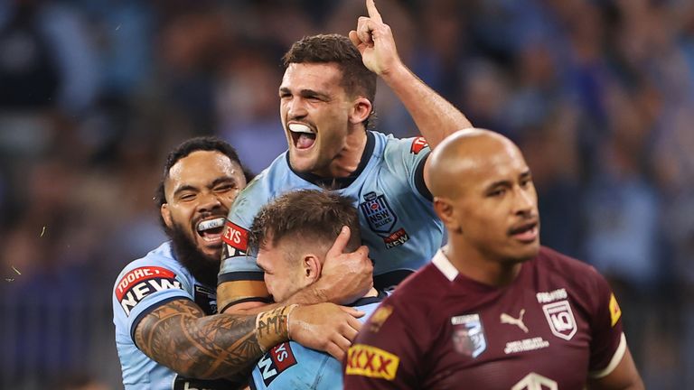 New South Wales Blues half-back Nathan Cleary is embraced by team-mates during the second game of the State of Origin series