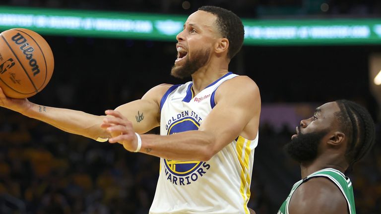 Golden State Warriors guard Stephen Curry shoots against Boston Celtics guard Jaylen Brown during Game 1