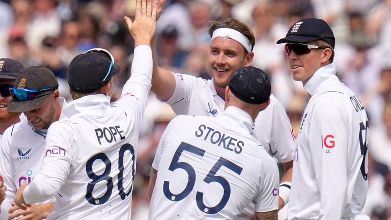 Stuart Broad celebrates taking the wicket of Devon Conway