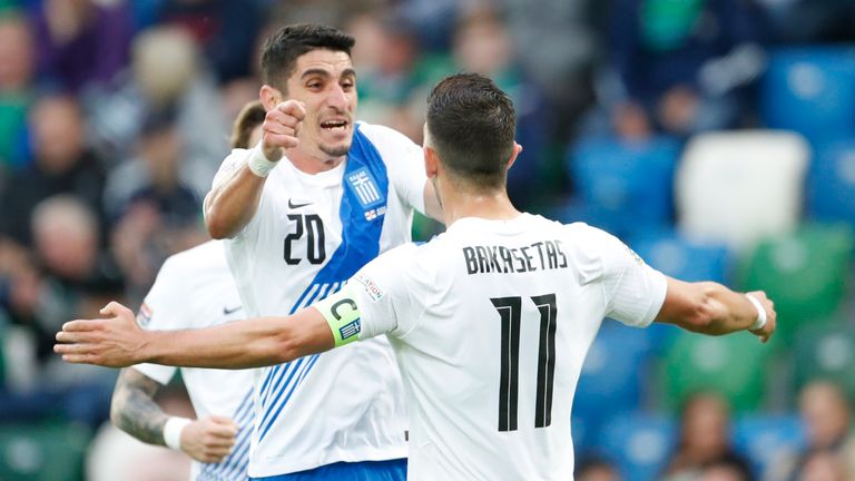 Greece's Tasos Bakasetas celebrates after scoring