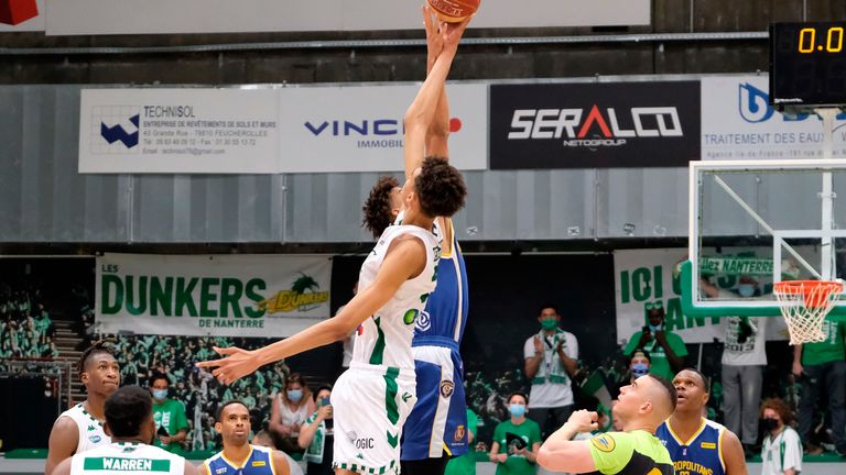 Ridiculous length: Victor Wembanyama (white shirt) in action for Nanterre in the French league shows off his crazy wingspan