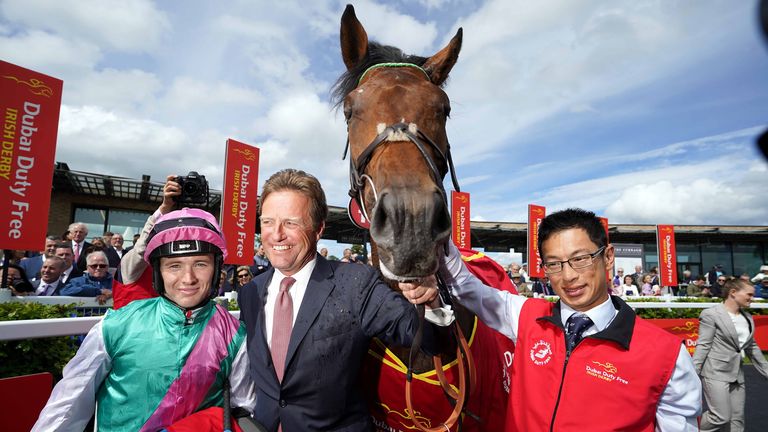Jockey Colin Keane (left) and trainer Ralph Beckett celebrate after winning the Dubai Duty Free Irish Derby with horse Westover during day two of the Dubai Duty Free Irish Derby Festival at Curragh Racecourse in County Kildare, Ireland. Picture date: Saturday June 25, 2022.