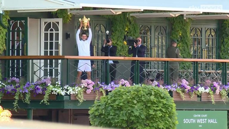 Novak Djokovic presented his fourth-straight Wimbledon trophy to the crowd after beating Nick Kyrgios in the final