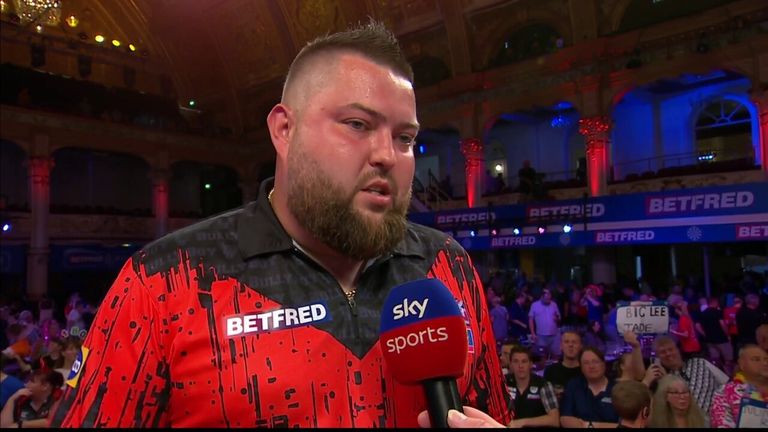Michael Smith speaks to Stuart Pyke after beating Andrew Gilding in round one of the World Matchplay