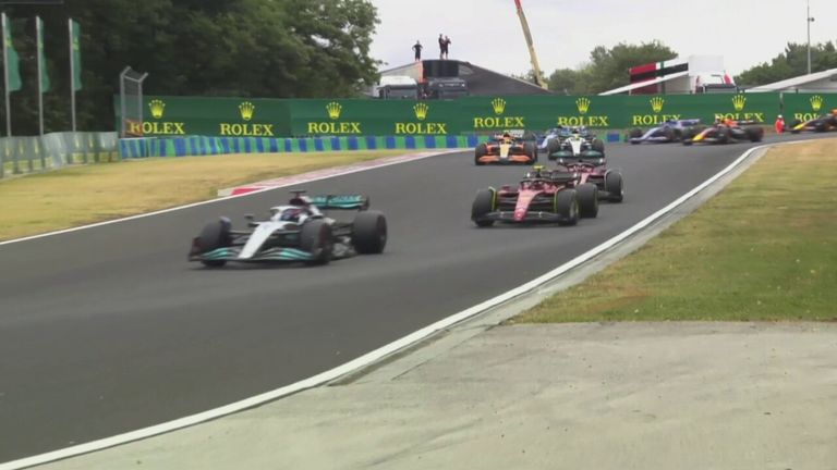 George Russell held off Ferrari on the first lap of the Hungarian Grand Prix as Alex Albon introduced the virtual safety car.
