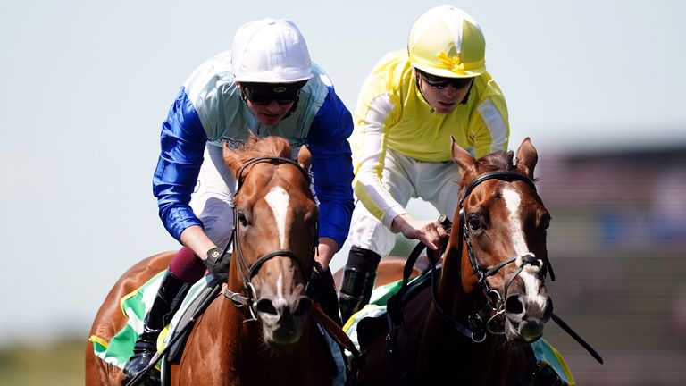 Jimi Hendrix ridden by jockey Rob Hornby (left) on their way to winning the bet365 Mile Handicap ahead of Positive Impact and Jamie Spencer (right) on Darley July Cup Day of the Moet and Chandon July Festival at Newmarket racecourse, Suffolk. Picture date: Saturday July 9, 2022.