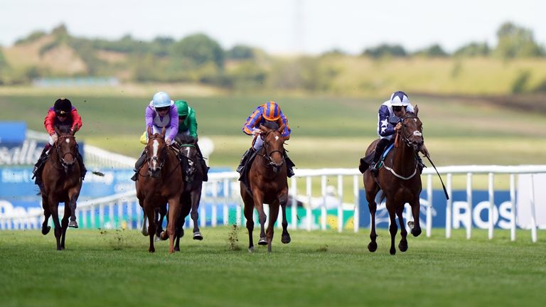 Alseyoob (right) and Sean Levey on the way to winning the Rossdales British EBF Maiden Fillies' Stakes