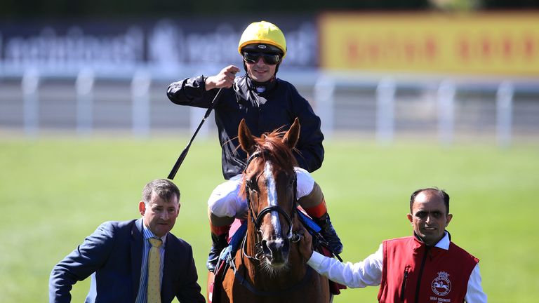 Andrea Atzeni celebrating after winning on Stradivarius