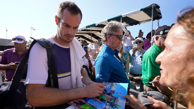 Andy Murray, of Britain, signs autographs after a first round win over Sam Querrey, of the United States, at the 2022 Infosys Hall of Fame Open, in Newport, R.I., Tuesday, July 12, 2022. (AP Photo/Steven Senne)