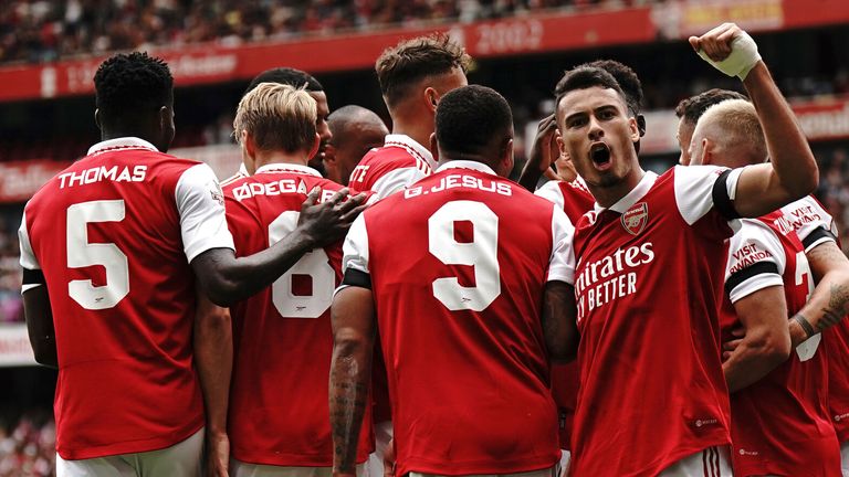Arsenal players celebrate after Gabriel Jesus puts the Gunners 3-0 up against Sevilla