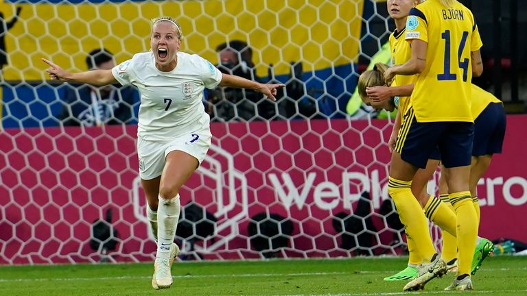 England's Beth Mead, left, celebrates after scoring her side's first goal against Sweden