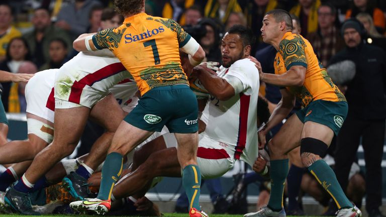 England's Billy Vunipola pushes the Australian defense back as he scores a try