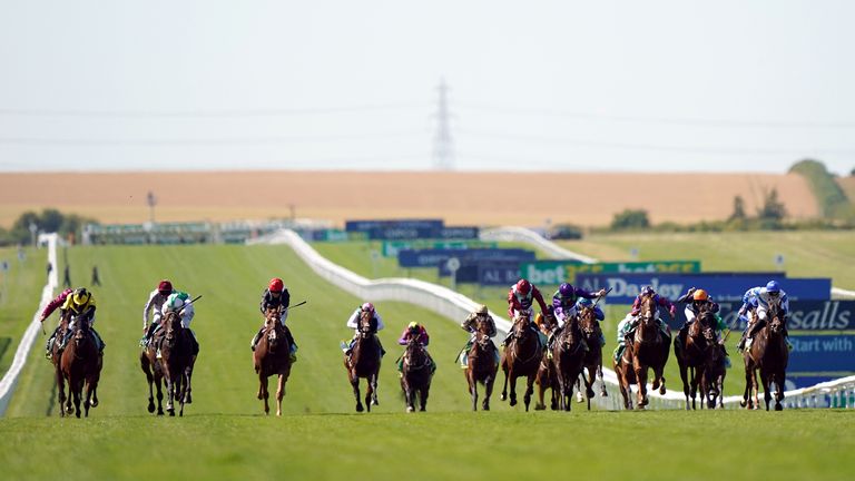 Bless Him (far left) sticks to the rail on the way to victory at Newmarket's July course