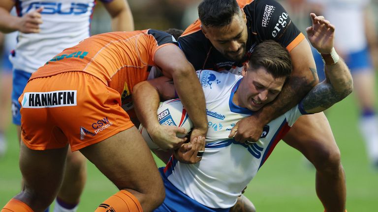 Wakefield Trinity's Jamie Shaul is tackled by Castleford Tigers' Kenny Edwards