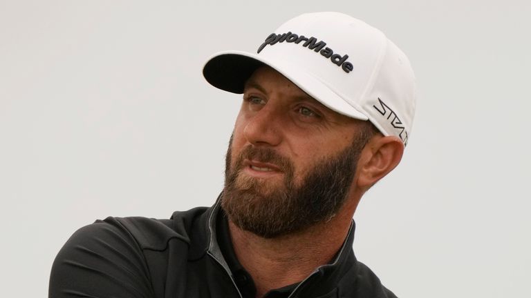 Dustin Johnson of the US watches his shot along the 11th fairway during the second round of the British Open golf championship on the Old Course at St. Andrews, Scotland, Friday July 15, 2022. The Open Championship returns to the home of golf on July 14-17, 2022, to celebrate the 150th edition of the sport's oldest championship, which dates to 1860 and was first played at St. Andrews in 1873. (AP Photo/Gerald Herbert)