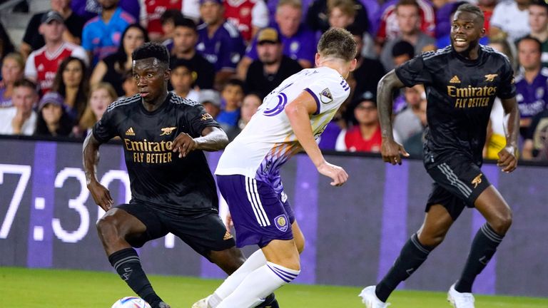Arsenal's Eddie Nketiah, left, tries to get around Orlando City's Michael Halliday, center, during the second half of a Florida Cup friendly match on Wednesday, July 20, 2022, in Orlando, Fla. (AP Photo/John Raoux)
