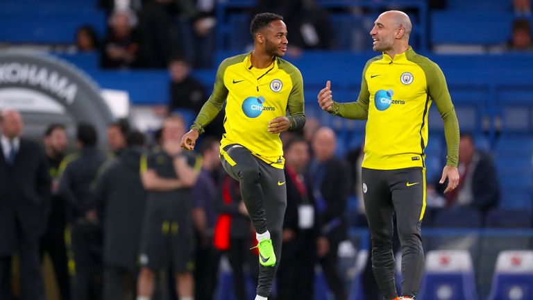 Manchester City&#39;s Raheem Sterling (left) and Manchester City&#39;s Pablo Zabaleta warming up before the Premier League match at Stamford Bridge, London.