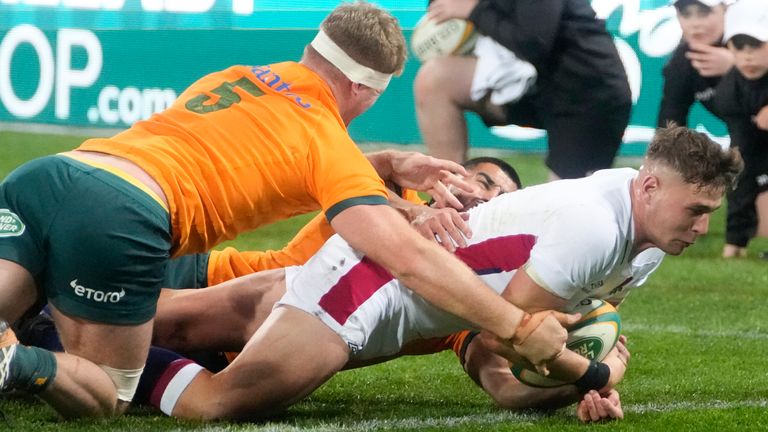 England&#39;s Freddie Steward scores a try as Australia&#39;s Matt Philip attempts the tackle