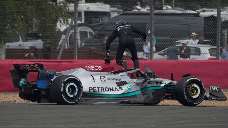 Mercedes driver George Russell of Britain jumps out of his car during the British Formula One Grand Prix at the Silverstone circuit