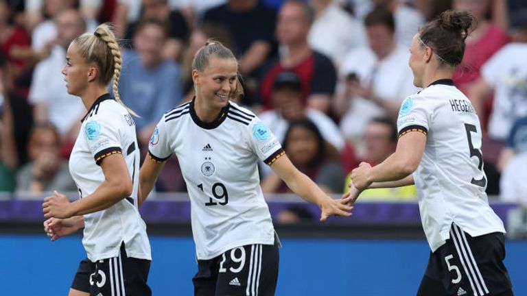 Klara Buehl of Germany celebrates their team&#39;s first goal with team-mates Giulia Gwinn and Marina Hegering 