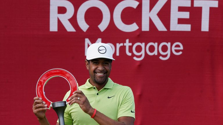 Tony Finau celebrates his win on the 18th green after the final round of the Rocket Mortgage Classic golf tournament, Sunday, July 31, 2022, in Detroit. (AP Photo/Carlos Osorio)


