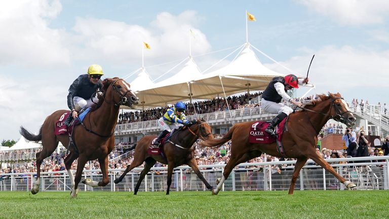 Kyprius (red cap), Stradivarius (yellow cap) and Trueshan battle it out in a thrilling Goodwood Cup