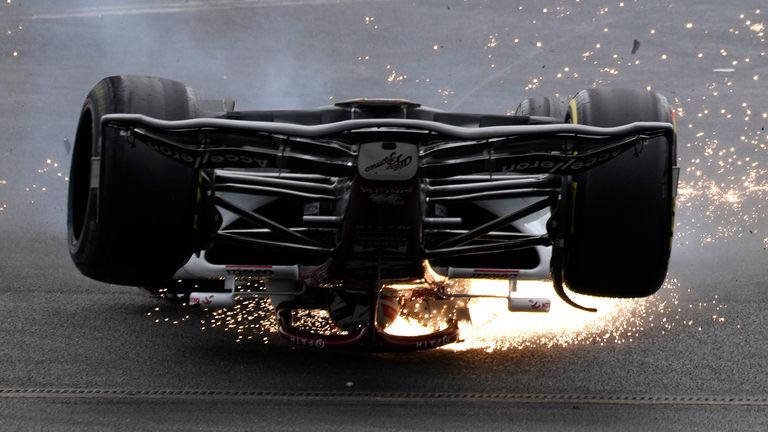 Alfa Romeo driver Guanyu Zhou of China crashes at the start of the British Formula One Grand Prix at the Silverstone circuit