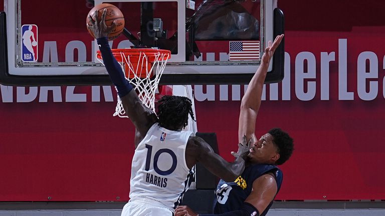 Kevon Harris #10 of the Minnesota Timberwolves dunks the ball against the Denver Nuggets during the 2022 Las Vegas Summer League on July 8, 2022 at the Cox Pavilion in Las Vegas, Nevada