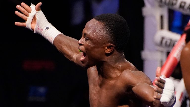 Isaac Dogboe, of Ghana, celebrates after defeating Adam Lopez in a featherweight title fight Saturday, June 19, 2021, in Las Vegas. (AP Photo/John Locher)