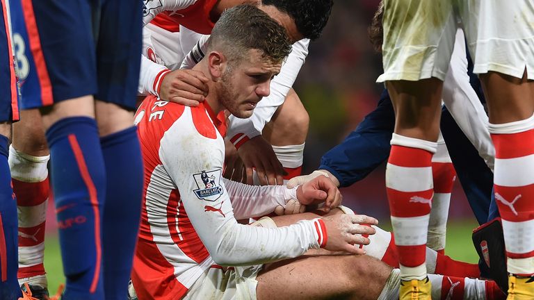 Jack Wilshere looks distraught after suffering an injury