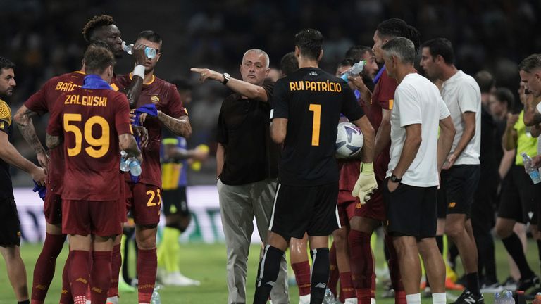 Jose Mourinho confers with his Roma team