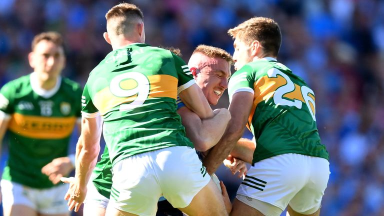 Paddy Small of Dublin is swarmed by Kerry duo Diarmuid O'Connor and Adrian Spillane